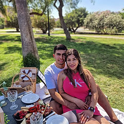 couple hugging each other in a picnic in the park