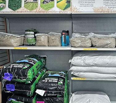Floor stocked grass seed in large and small bags