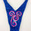 Thumbnail: back of royal blue competition figure suit with neon pink and clear crystals