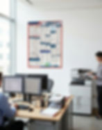 Labor Law Poster hanging an office, with people working