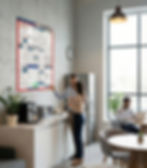 Labor law poster hanging in an office with employees around