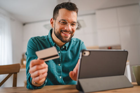 debit card - person on tablet - spending money - iStock-1952837010.jpg