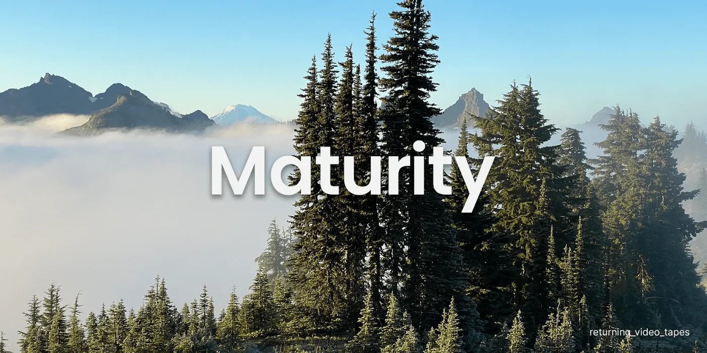 The word "Maturity" on a nature themed background