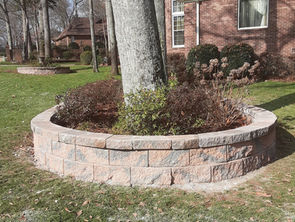 Circular retaining wall landscape bed installation