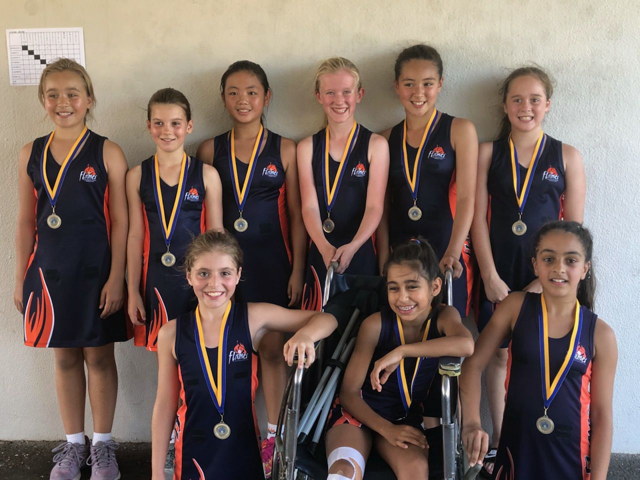 Flames team group photo with medals
