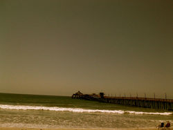 couple on shore, beside pier