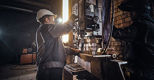 man-is-working-with-giant-drill-busy-metal-factory.jpg