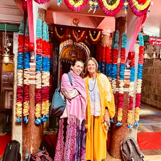 A group of ladies in front of an Indian display