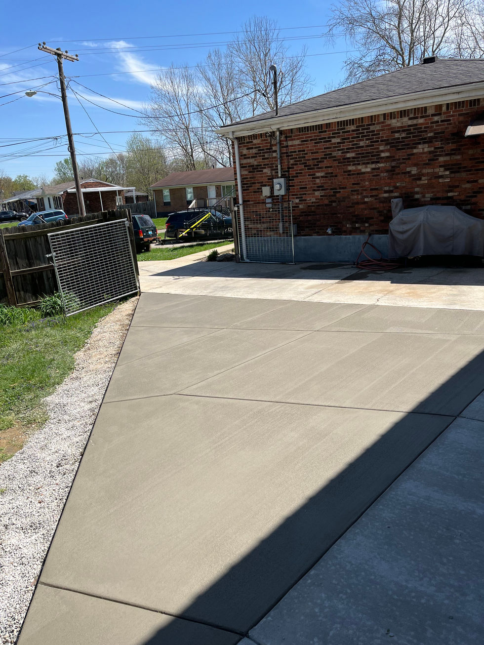 Concrete garage floor with trowel finish.   Concrete apron and drive way addition with brush finish Louisville, Kentucky