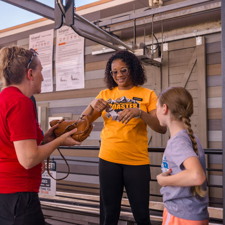 Mother and daughter getting their tickets to ride The Branson Coaster, the best roller coaster in Branson and best mountain coaster in Branson, MO