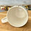 Thumbnail: White ceramic mug, inside view, on wooden surface, ChernyArtStudio, other mugs.