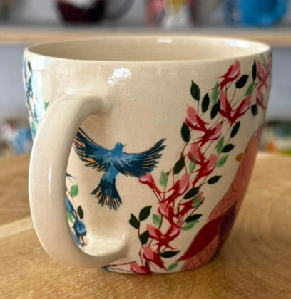 Thumbnail: Hand-painted mug with blue bird and floral design on cream background