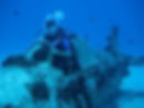 A diver testing the pressure of the tanks.