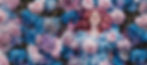 Woman in pink wig lies among blue and pink flowers, wearing a floral dress. Butterflies flutter around. Serene and whimsical mood. Image of Blume Bauer for the Yellow Studio.