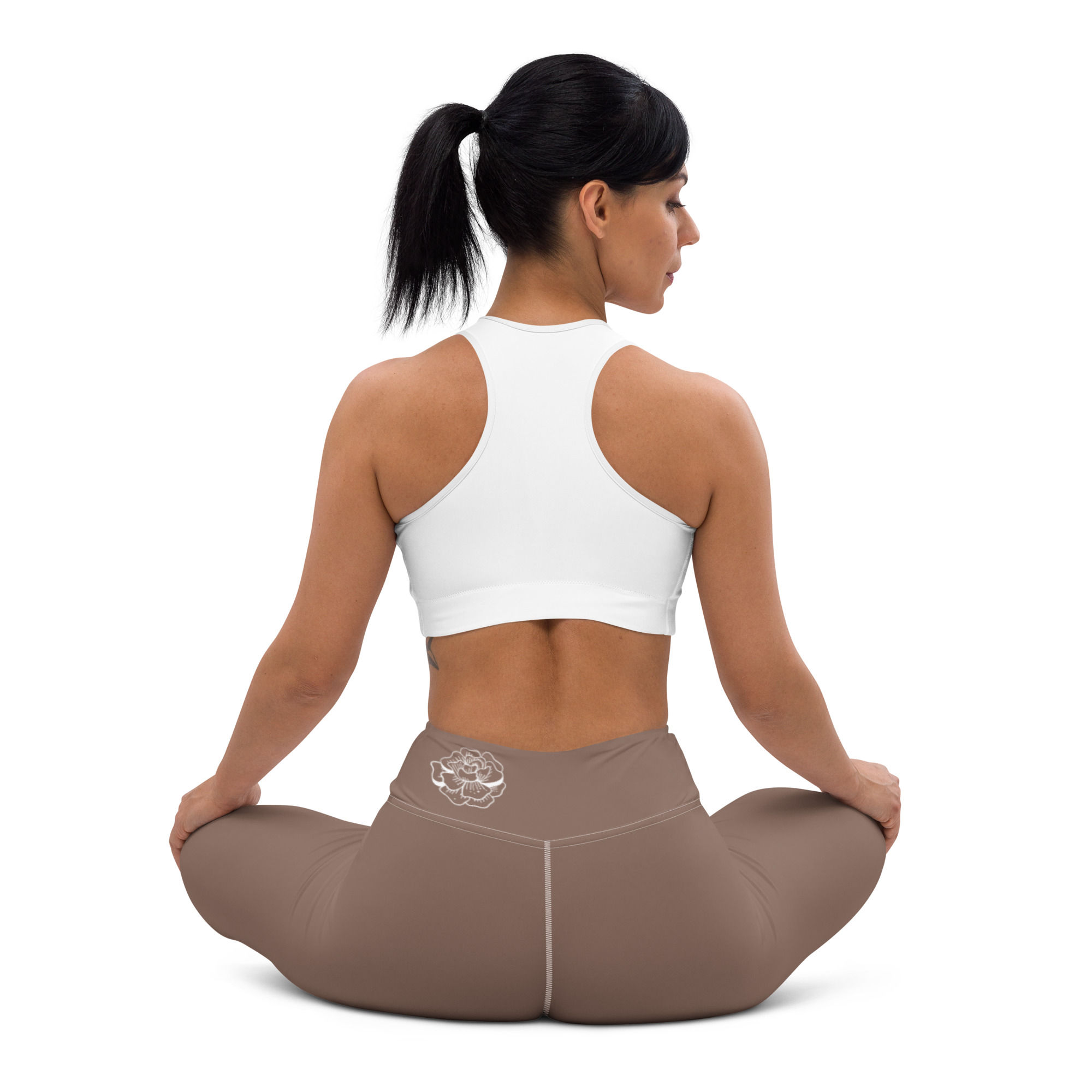 Yoga model in sit pose wearing Taupe Yoga Pants, back view