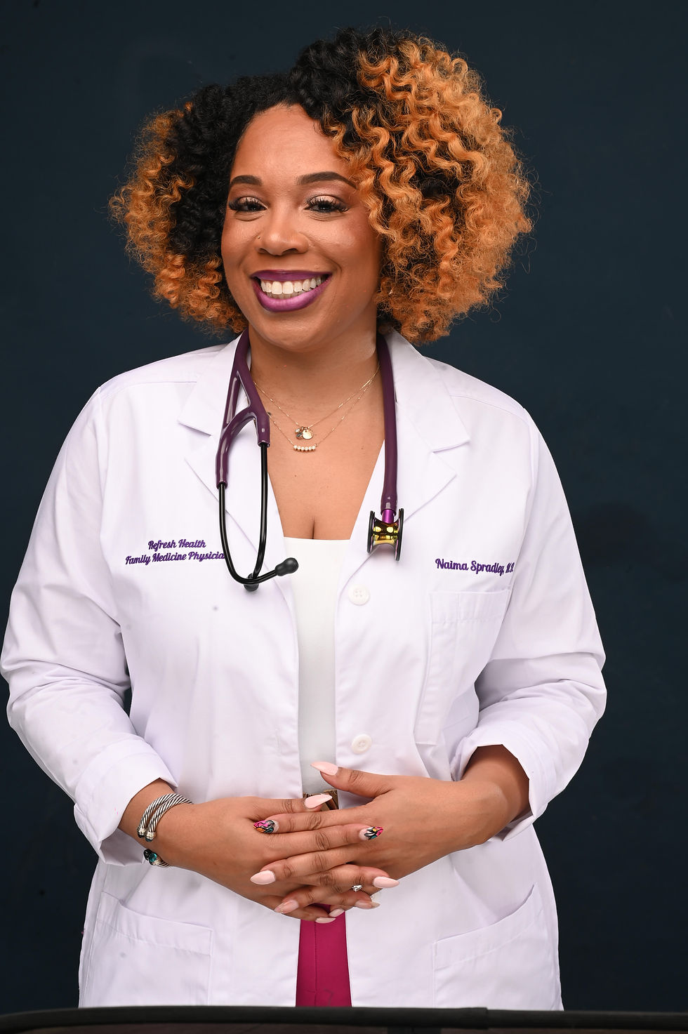 Dr. Naima Spradley in her white coat
