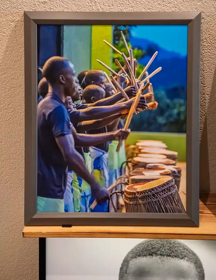 Drummers playing with sticks over drums; Atelier-Galerie AVO; Les pêcheurs du lac Kivu