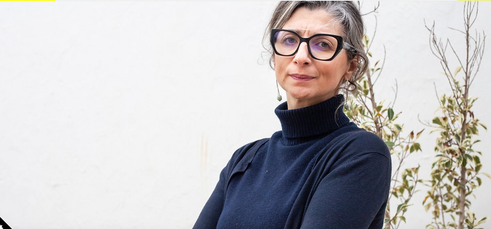 UN special rapporteur wearing a turtleneck