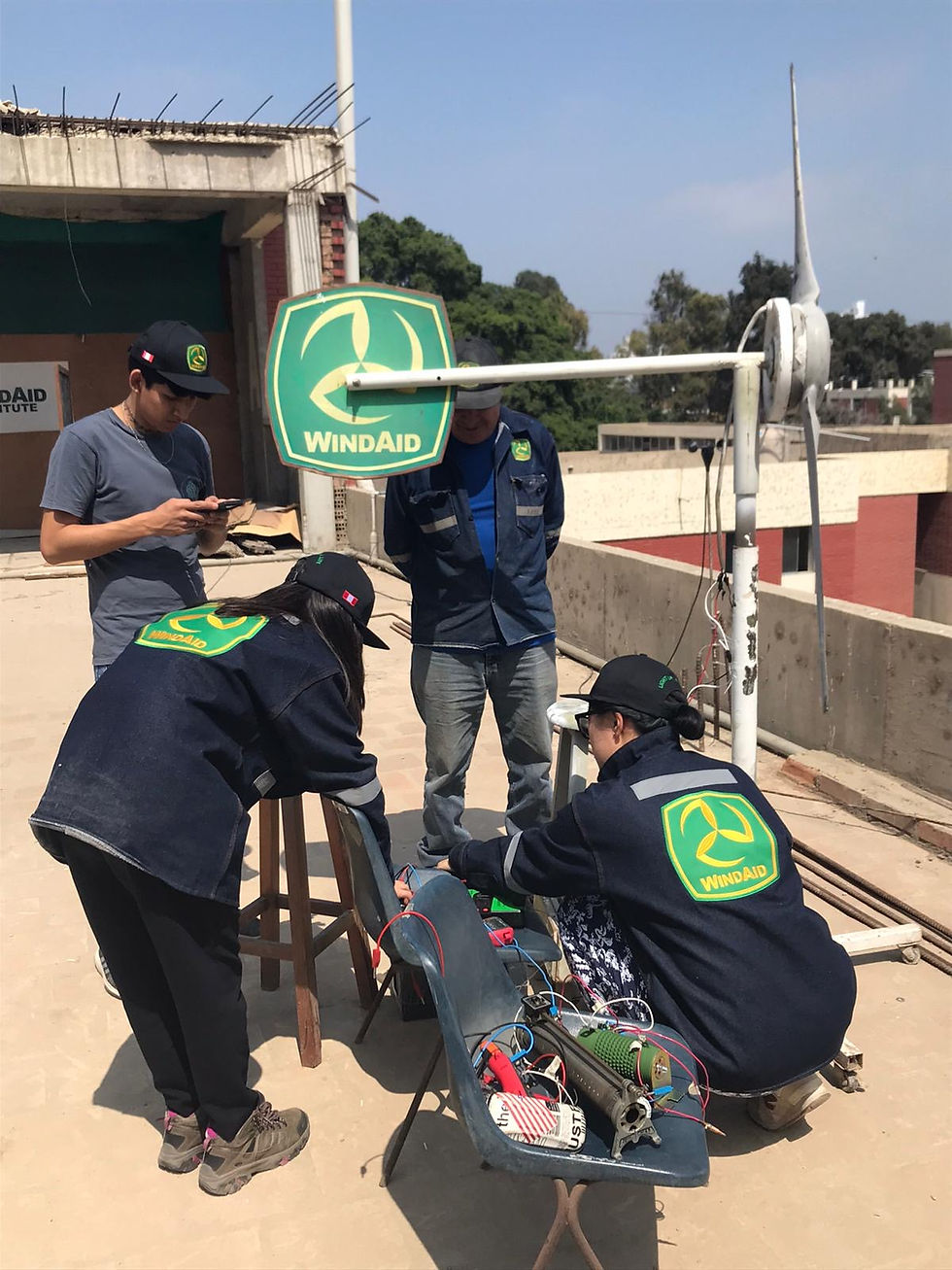 Iris and Alyssa working with the WindAid team in Peru to build the Wind Turbine.