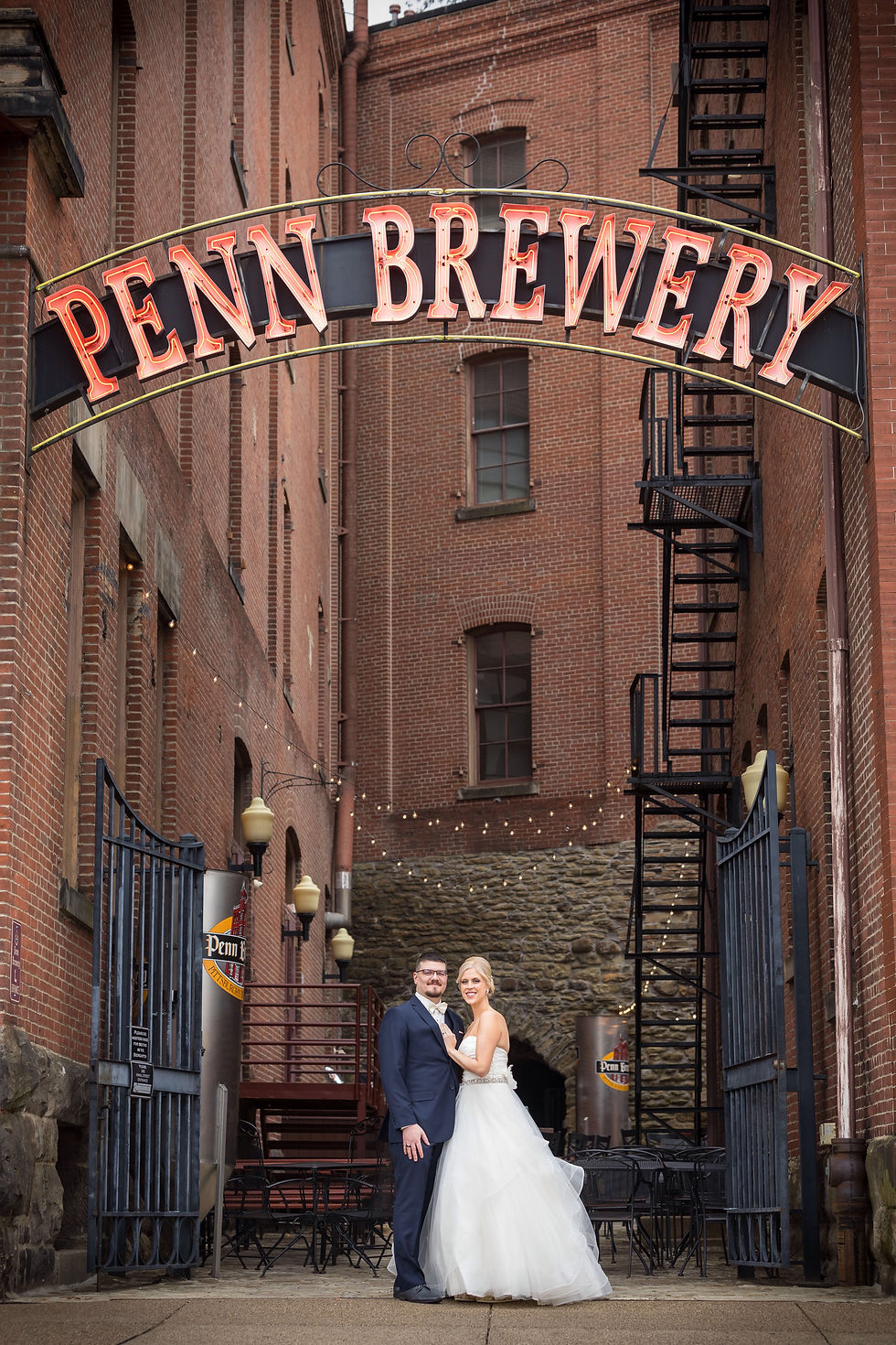Bride and Groom under Penn Brewery sign