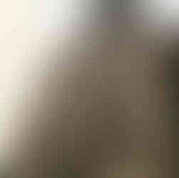 tall building with sun in window reflection