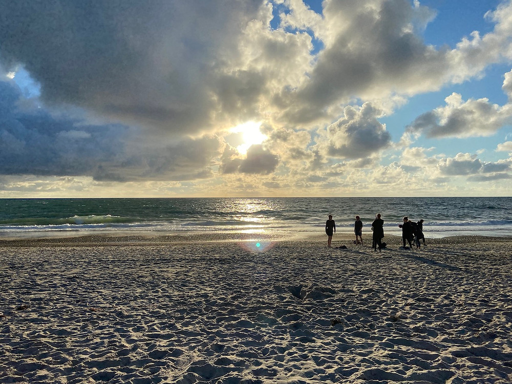 People on beach at sunset