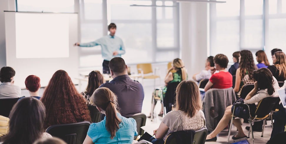speaker-giving-talk-business-meeting-rear-view-unrecognized-participant-audience.jpg