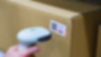 barcode scanner scanning a barcode on a box
