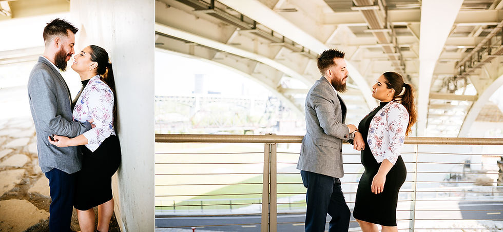 Couple pose together in a hug under a bridge in Cleveland, Ohio