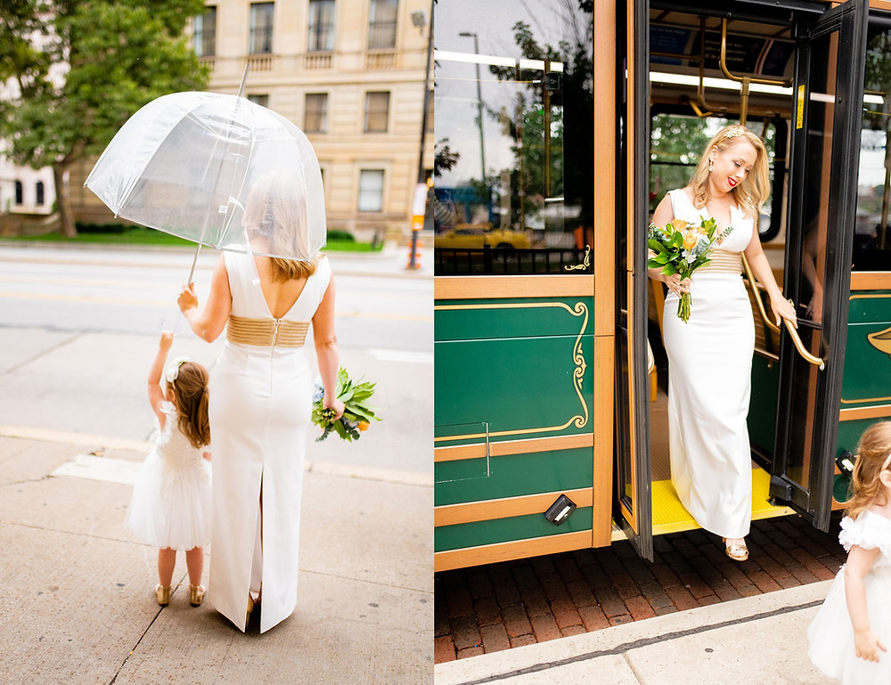 bride and flower girl wait to leave trolly in the flats of cleveland