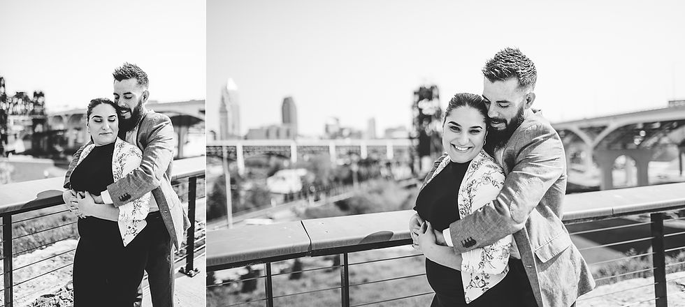 Portrait of man and woman standing near a Cleveland view