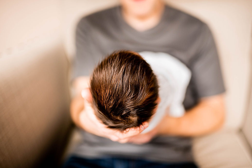 father holds newborn baby boy near Cleveland Ohio