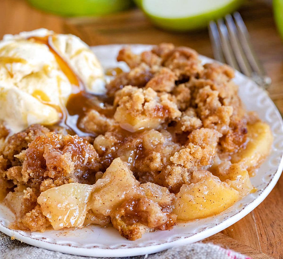 Apple crumble on a plate served with ice cream