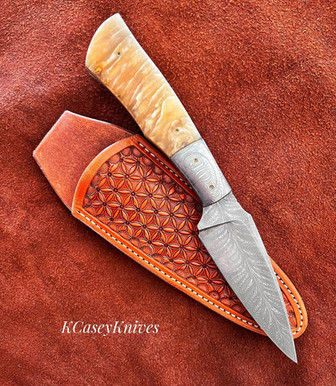 Knife by Kevin Casey. Feather and Musk Ox Hunter knife.