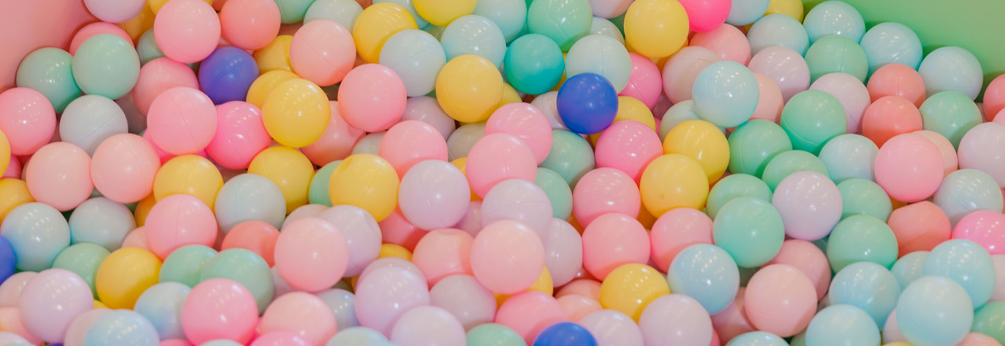 Ball pit filled with pastel-colored balls