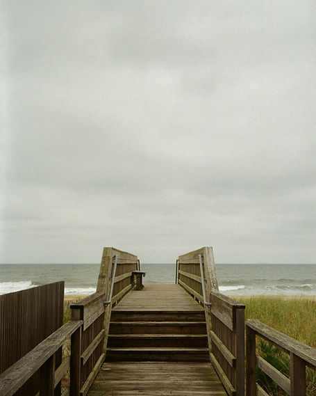 a boardwalk leading to the ocean