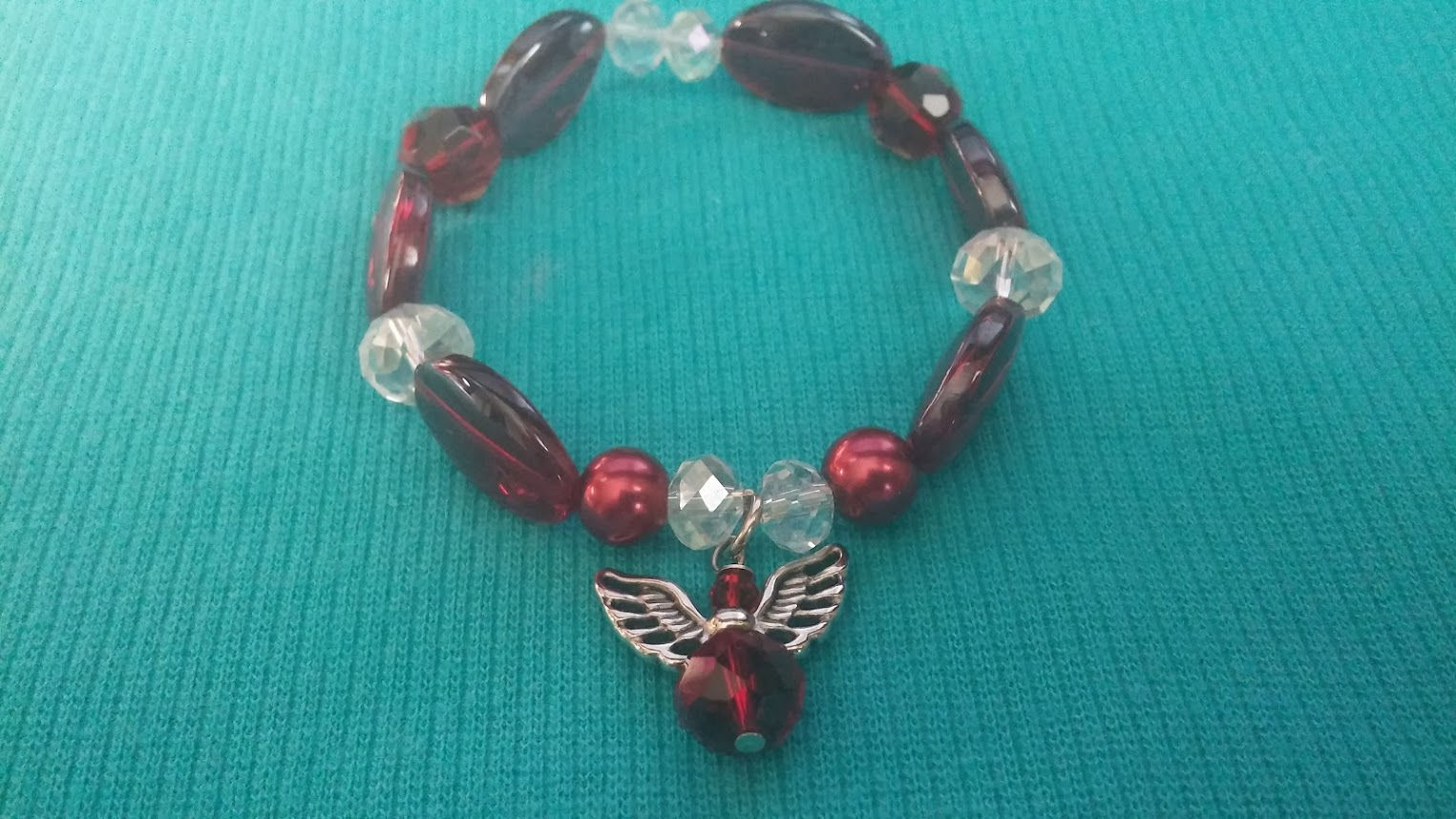 007.-July birthstone color ruby with angel.