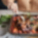 Emmylou pullng apart Slow Cooked Lamb with warm spices, sweet Medjool dates, zesty orange and simmered with lentils and vegetables.