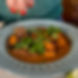 A plate of Sweet Beef Curry made with tender beef, roasted sweet potato, satay and red curry paste, coconut milk and kaffir lime leaves.