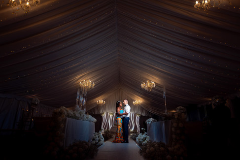 Wide view of wedding marquee during evening celebrations, by Hektor Lleshi Photography