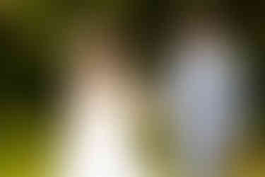 Elegant wedding portrait in historic stone archway at Cheshunt Register Office