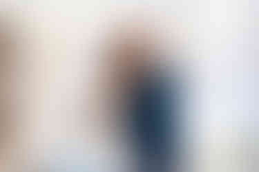 Bride and groom sharing first dance inside marquee