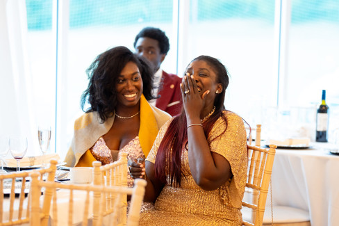 Guests reacting joyfully during wedding reception