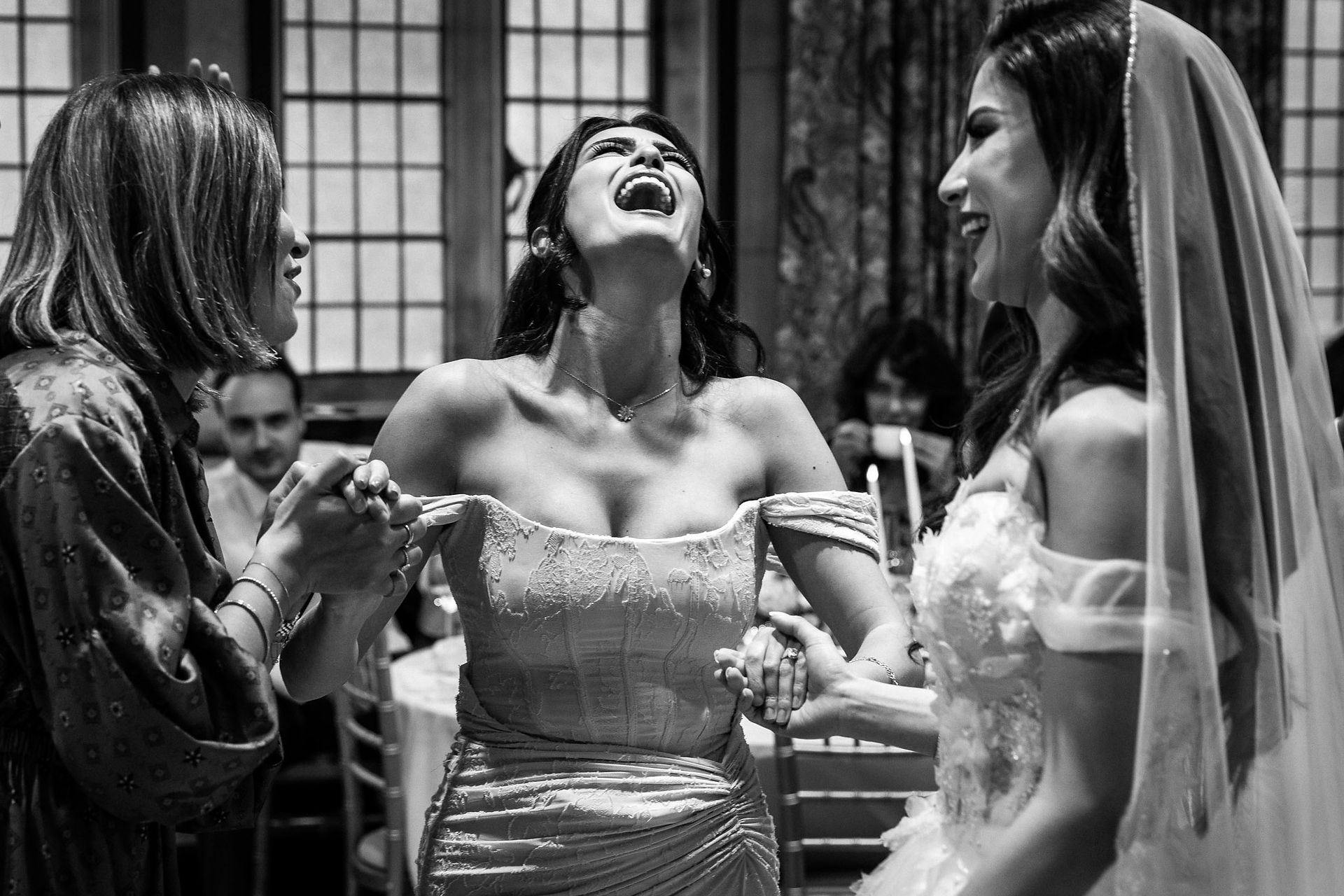Groom dancing during wedding reception in Hertfordshire