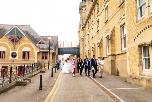 Guests celebrating newlyweds outside Cheshunt Register Office captured by Hektor Lleshi Photography