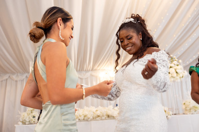 Bride dancing with guests at London Shenley Club