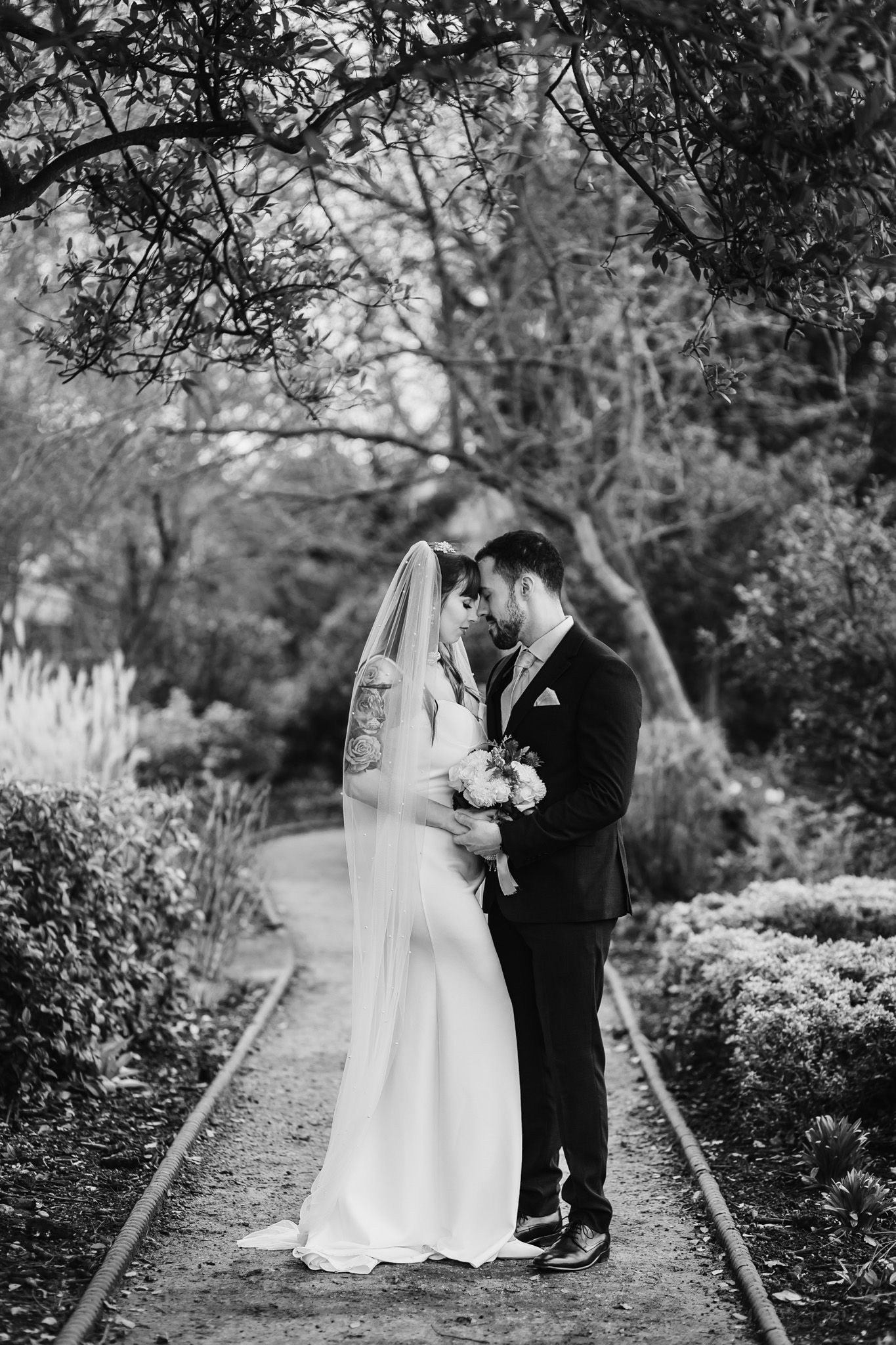 Langtons House wedding couple portraits in a romantic garden setting, captured by Hektor Lleshi Photography, London wedding photographer specialising in natural, documentary style moments