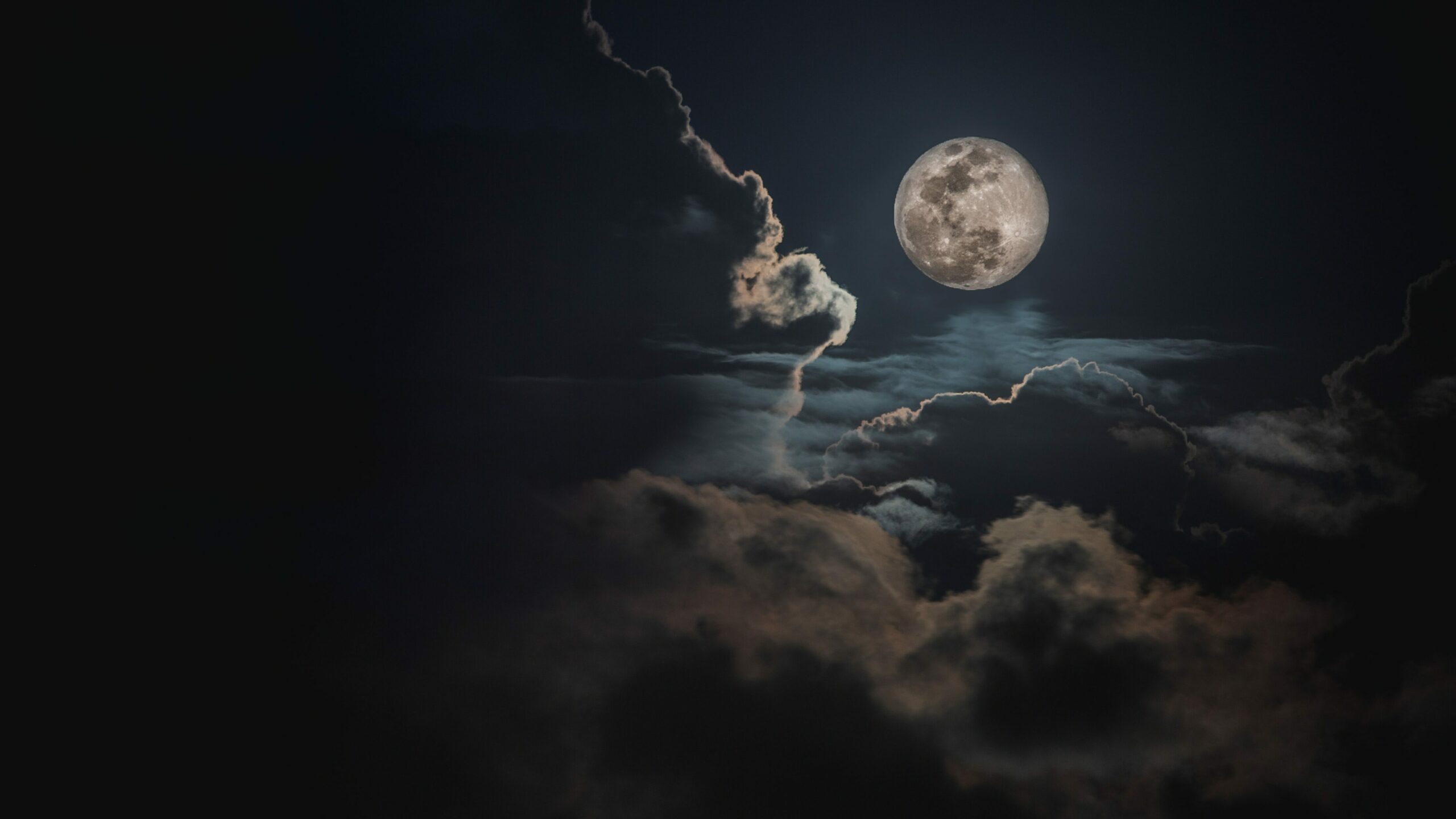 Image of a full moon and clouds.