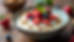 Close-up view of a bowl of creamy Greek yogurt topped with fresh berries and nuts