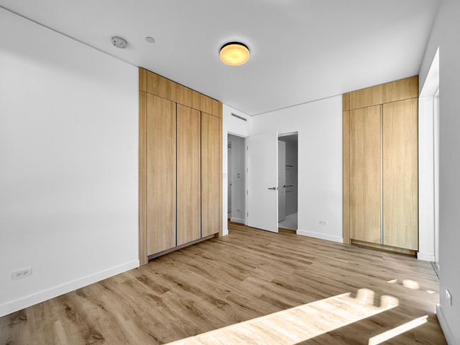 Master bedroom in the main home of Scenic Crest Villas with large windows and natural light.